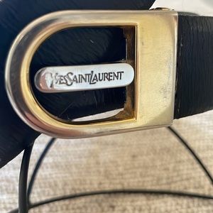 YSL/ YVES SAINT LAURENT VTG black leather belt with gold/silver toned buckle